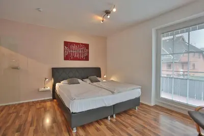 Ein Bett oder Betten in einem Zimmer der Unterkunft Parkdomizil Parkdomizil Appartement 5