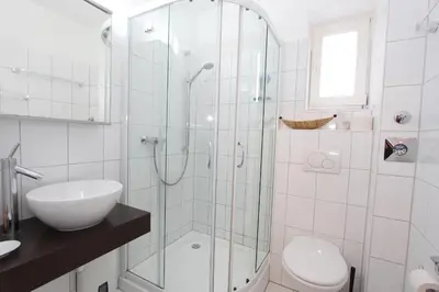 Ein Badezimmer in der Unterkunft Parkdomizil Parkdomizil Appartement 5