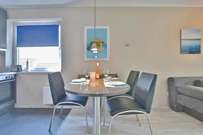 Ein Sitzbereich in der Unterkunft Strandperle Strandperle Appartement 201