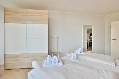 Ein Bett oder Betten in einem Zimmer der Unterkunft Berliner Hof Berliner Hof Appartement 116