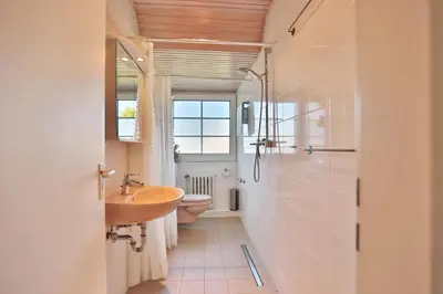 Ein Badezimmer in der Unterkunft Strandläufer Strandläufer Appartement 1