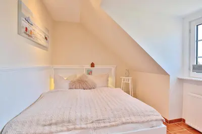 Ein Bett oder Betten in einem Zimmer der Unterkunft Haus am Falkenweg Haus am Falkenweg Appartement 6