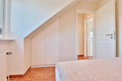 Ein Bett oder Betten in einem Zimmer der Unterkunft Haus am Falkenweg Haus am Falkenweg Appartement 6