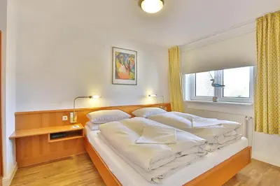 Ein Bett oder Betten in einem Zimmer der Unterkunft Seebrücke Seebrücke Appartement 10