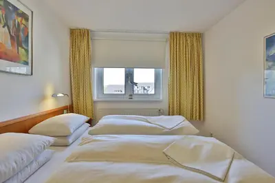 Ein Bett oder Betten in einem Zimmer der Unterkunft Seebrücke Seebrücke Appartement 10