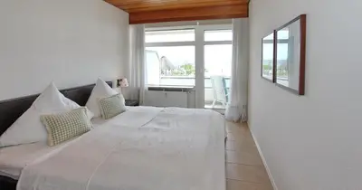 Ein Bett oder Betten in einem Zimmer der Unterkunft Strandperle Strandperle Appartement 107