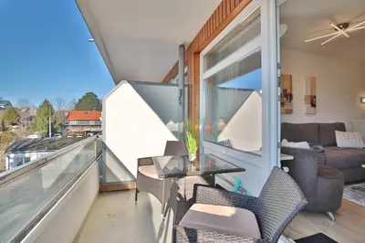 Ein Sitzbereich in der Unterkunft Strandperle Strandperle Appartement 103