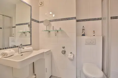 Ein Badezimmer in der Unterkunft Strandperle Strandperle Appartement 103