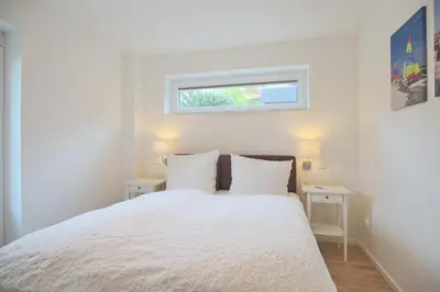 Ein Bett oder Betten in einem Zimmer der Unterkunft Haus Küstenkinder Haus Küstenkinder Marie Appartement 1