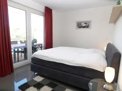 Ein Bett oder Betten in einem Zimmer der Unterkunft Strandglück Haus B Strandglück Appartement 12B