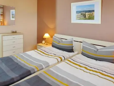 Ein Bett oder Betten in einem Zimmer der Unterkunft Strandglück Haus C Strandglück Appartement 15C