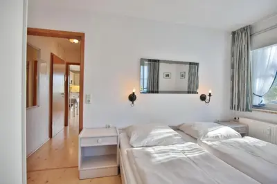 Ein Bett oder Betten in einem Zimmer der Unterkunft Ostseeblick Ostseeblick Appartement 6