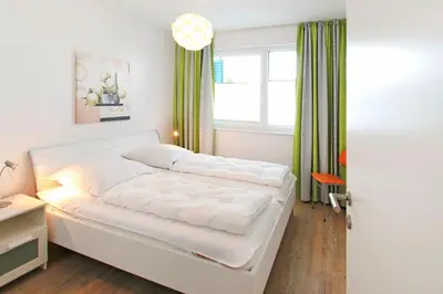 Ein Bett oder Betten in einem Zimmer der Unterkunft Strandglück Haus B Strandglück Appartement 8B