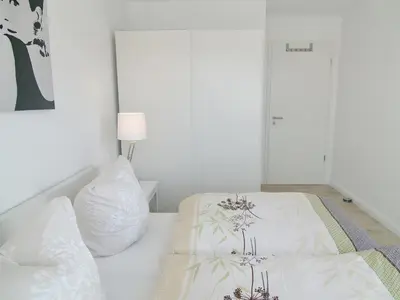 Ein Bett oder Betten in einem Zimmer der Unterkunft Strandglück Haus A Strandglück Appartement 7A