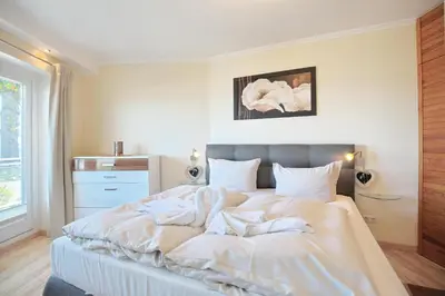 Ein Bett oder Betten in einem Zimmer der Unterkunft Haus Montemare Haus Montemare Appartement 1