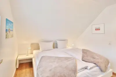 Ein Bett oder Betten in einem Zimmer der Unterkunft Ostseeblick Ostseeblick Appartement 19