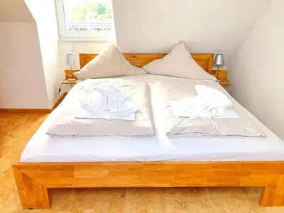 Ein Bett oder Betten in einem Zimmer der Unterkunft Residenz Alte Bergstraße Residenz Alte Bergstrasse Appartement 19