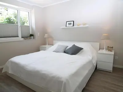 Ein Bett oder Betten in einem Zimmer der Unterkunft Strandglück Haus C Strandglück Appartement 2C