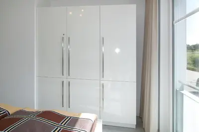 Ein Bett oder Betten in einem Zimmer der Unterkunft Strandglück Haus C Strandglück Appartement 09C