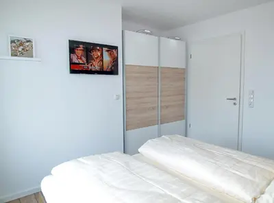 Ein Bett oder Betten in einem Zimmer der Unterkunft Strandglück Haus B Strandglück Appartement 15B