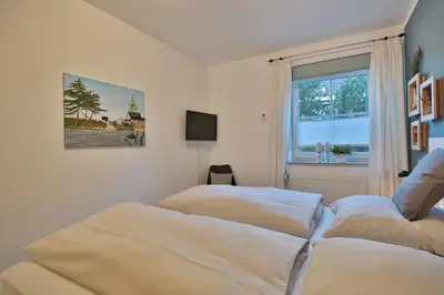 Ein Bett oder Betten in einem Zimmer der Unterkunft Residenz Alte Bergstraße Residenz Alte Bergstrasse Appartement 5