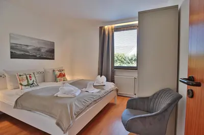Ein Bett oder Betten in einem Zimmer der Unterkunft Doppelhaushälfte Am Knurrhahn Am Knurrhahn Appartement 1