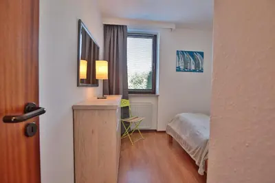 Ein Bett oder Betten in einem Zimmer der Unterkunft Doppelhaushälfte Am Knurrhahn Am Knurrhahn Appartement 1