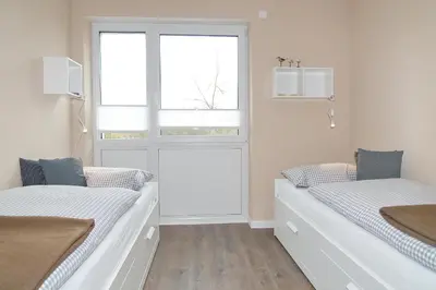 Ein Bett oder Betten in einem Zimmer der Unterkunft Kurparkresidenz Kurparkresidenz Appartement 13