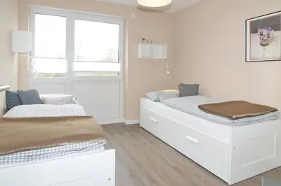 Ein Bett oder Betten in einem Zimmer der Unterkunft Kurparkresidenz Kurparkresidenz Appartement 13