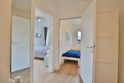 Ein Bett oder Betten in einem Zimmer der Unterkunft Feriendomizil Neue Bergstrasse Feriendomizil Neue Bergstrasse 11 Appartement 8