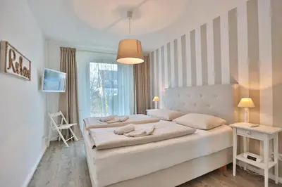 Ein Bett oder Betten in einem Zimmer der Unterkunft Kurparkresidenz Kurparkresidenz Appartement 4