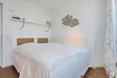Ein Bett oder Betten in einem Zimmer der Unterkunft Seetempel Seetempel Appartement 45