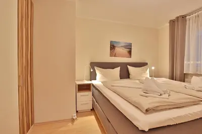 Ein Bett oder Betten in einem Zimmer der Unterkunft Seebrücke Seebrücke Appartement 5