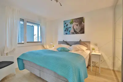 Ein Bett oder Betten in einem Zimmer der Unterkunft Strandglück Haus C Strandglück Appartement 7C
