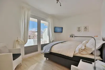 Ein Bett oder Betten in einem Zimmer der Unterkunft Strandglück Haus C Strandglück Appartement 7C