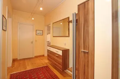 Ein Bett oder Betten in einem Zimmer der Unterkunft Haus an der Strandallee 126 Appartement Seeblick