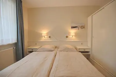 Ein Bett oder Betten in einem Zimmer der Unterkunft Haus Parkblick Parkblick Appartement 2
