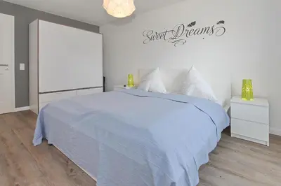 Ein Bett oder Betten in einem Zimmer der Unterkunft Kurparkresidenz Kurparkresidenz Appartement 11