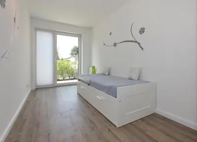 Ein Bett oder Betten in einem Zimmer der Unterkunft Kurparkresidenz Kurparkresidenz Appartement 11