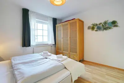 Ein Bett oder Betten in einem Zimmer der Unterkunft Haus Parkblick Parkblick Appartement 4