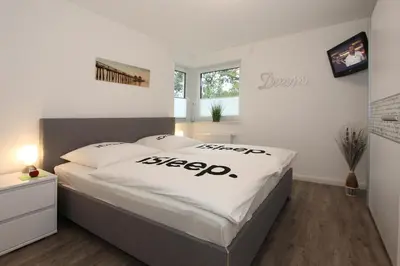 Ein Bett oder Betten in einem Zimmer der Unterkunft Kurparkresidenz Kurparkresidenz Appartement 21