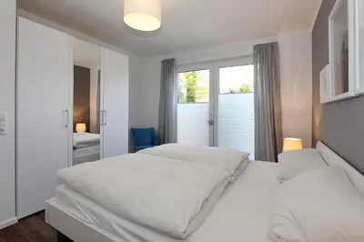 Ein Bett oder Betten in einem Zimmer der Unterkunft Haus am Hörn Tide am Hörn