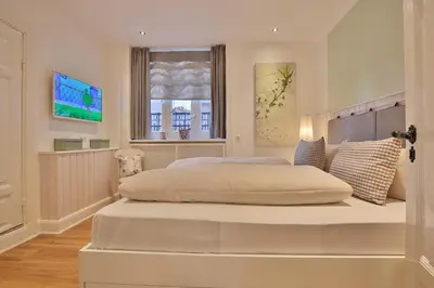 Ein Bett oder Betten in einem Zimmer der Unterkunft Villa Schöneck Villa Schöneck Appartement 1