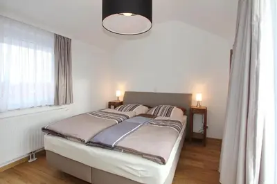 Ein Bett oder Betten in einem Zimmer der Unterkunft Domizil am Möwenberg Domizil am Möwenberg Appartement 9