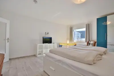 Ein Bett oder Betten in einem Zimmer der Unterkunft Haus Oceanfront, Appartement 11
