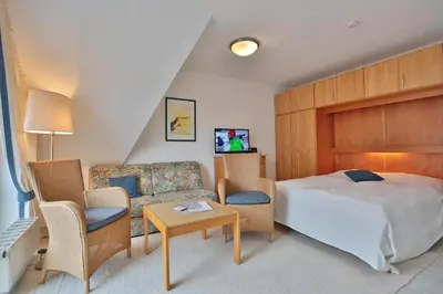 Ein Bett oder Betten in einem Zimmer der Unterkunft Haus Parkblick Parkblick Appartement 11