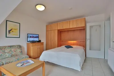 Ein Bett oder Betten in einem Zimmer der Unterkunft Haus Parkblick Parkblick Appartement 11