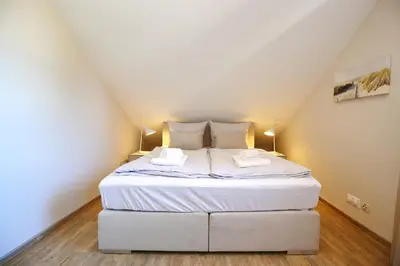Ein Bett oder Betten in einem Zimmer der Unterkunft Haus Sonnenschein Haus Sonnenschein Appartement 7 Strandnest