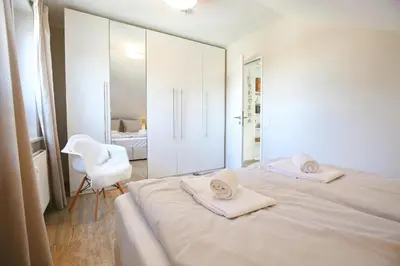 Ein Bett oder Betten in einem Zimmer der Unterkunft Haus Sonnenschein Haus Sonnenschein Appartement 7 Strandnest