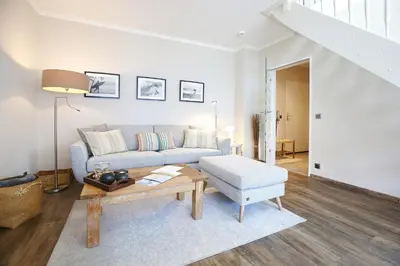 Ein Sitzbereich in der Unterkunft Haus Sonnenschein Haus Sonnenschein Appartement 7 Strandnest